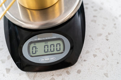 Close-up of clock on table