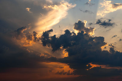 Low angle view of dramatic sky during sunset