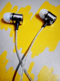 High angle view of yellow paper on table