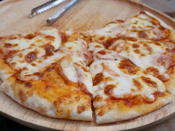 Close-up of pizza served on table