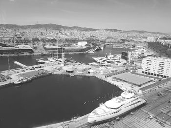 High angle view of buildings by sea against sky