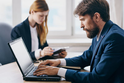 Business colleagues working at office