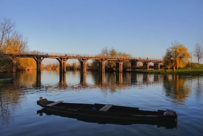 Bridge over river against clear sky