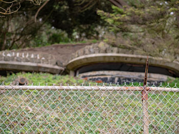 Bridge seen through chainlink fence