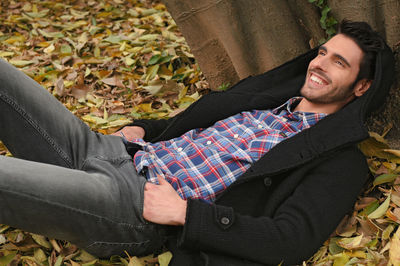 High angle view of man and woman relaxing in autumn