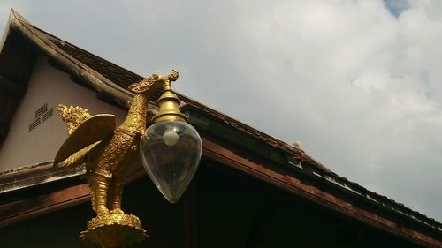 Low angle view of statue against sky