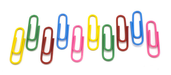 Close-up of multi colored pencils over white background