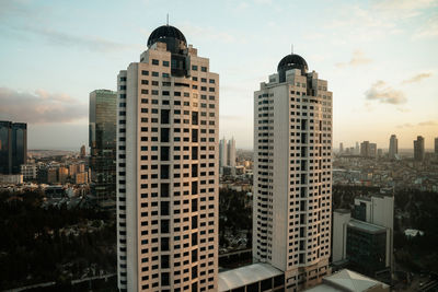 Buildings in city against sky
