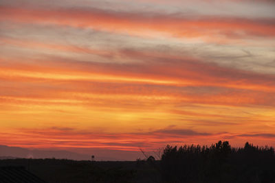 Scenic view of dramatic sky during sunset