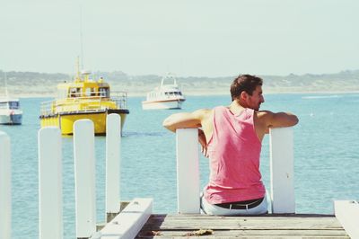 Woman standing on pier