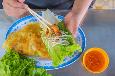 Midsection of man having food