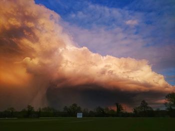 Scenic view of landscape against cloudy sky