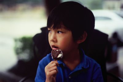 Portrait of boy eating ice cream