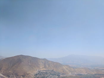 Scenic view of arid landscape against clear sky