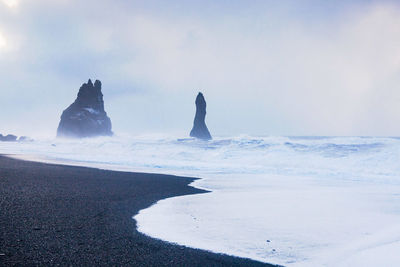 Scenic view of sea against sky during winter