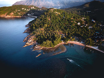 Aerial view of island coastline with beaches at golden hour