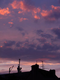 Low angle view of built structure against cloudy sky