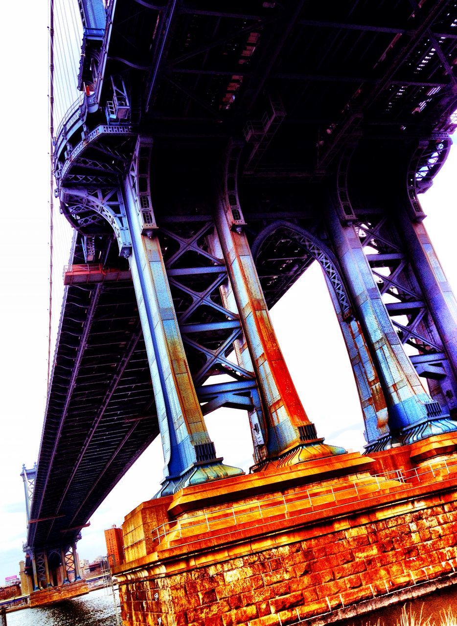 built structure, architecture, low angle view, engineering, famous place, connection, travel destinations, international landmark, bridge - man made structure, tourism, travel, metal, clear sky, capital cities, transportation, eiffel tower, suspension bridge, culture, sky, blue