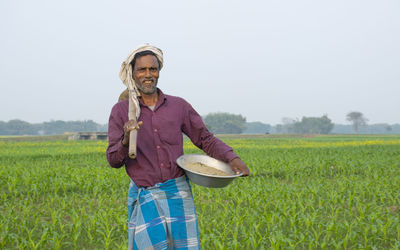 Full length of a man standing in field