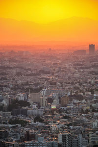 High angle view of city against sky during sunset