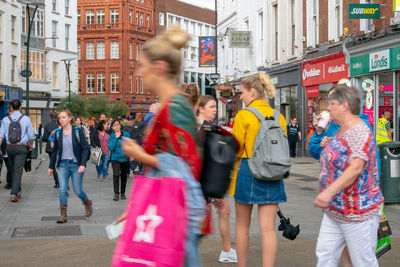 People walking on street in city