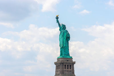 Low angle view of statue against sky