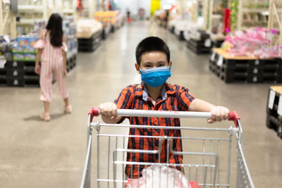 Portrait of boy shopping in store