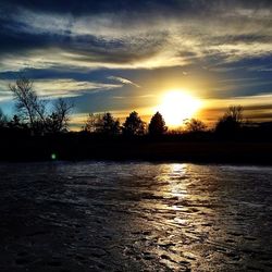 Scenic view of sunset over river