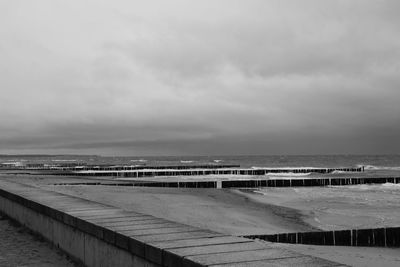 Pier over sea against sky