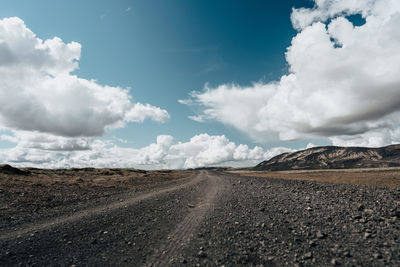 Road amidst landscape against sky