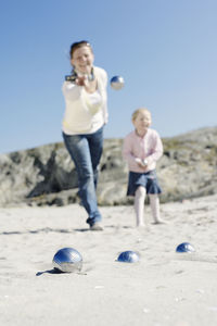 Mother and daughter playing boules