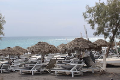 Panoramic view of lounge chairs on beach