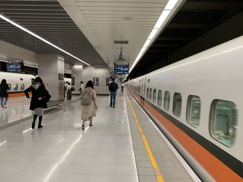 People at railroad station platform