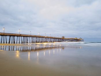 Pier over sea against sky