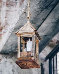 Low angle view of wooden lantern hanging 
