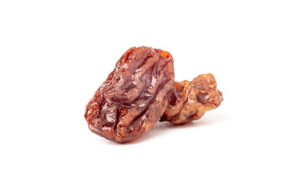 Close-up of bread in plate against white background