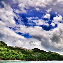 Scenic view of mountains against cloudy sky