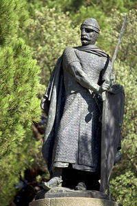 Statue of buddha against trees