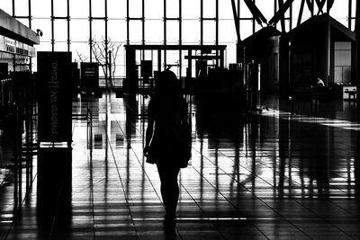 Full length of woman walking in city