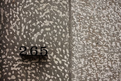 Close-up of text on wall