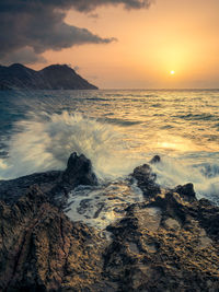 Scenic view of sea against sky during sunset