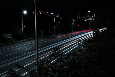 High angle view of light trails on city street at night