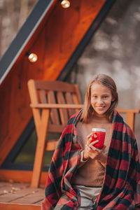 Portrait of smiling girl holding food