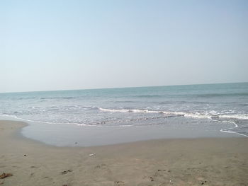 Scenic view of beach against clear sky