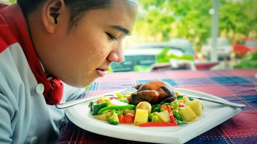 Close-up of man eating food