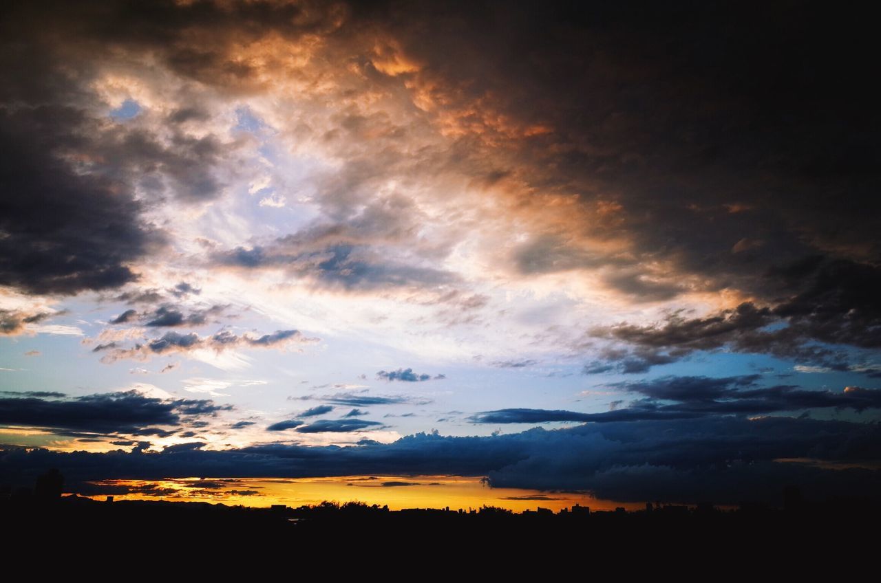 tranquil scene, scenics, sky, beauty in nature, tranquility, sunset, landscape, cloud - sky, silhouette, nature, dramatic sky, idyllic, cloud, cloudy, majestic, weather, field, atmospheric mood, moody sky, outdoors