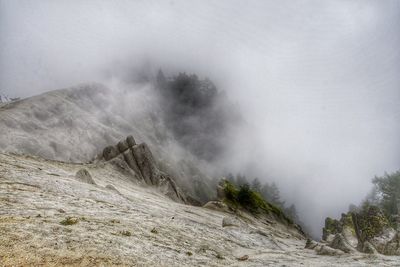 Mountain against cloudy sky