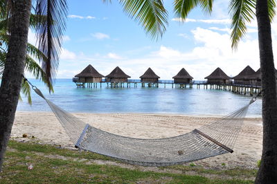 Built structure on beach against sky
