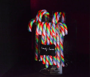 Close-up of multi colored candies against black background