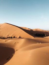 Scenic view of desert against clear sky
